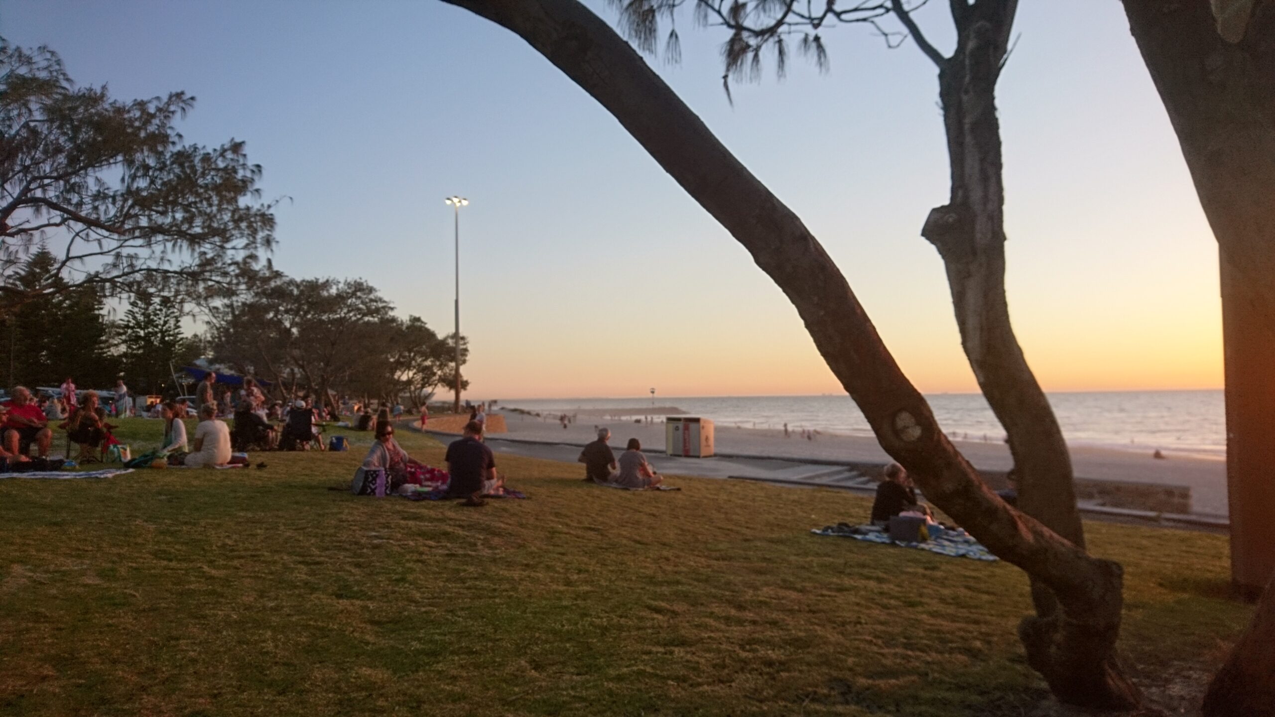 People watching the sun set at Cottesloe beach