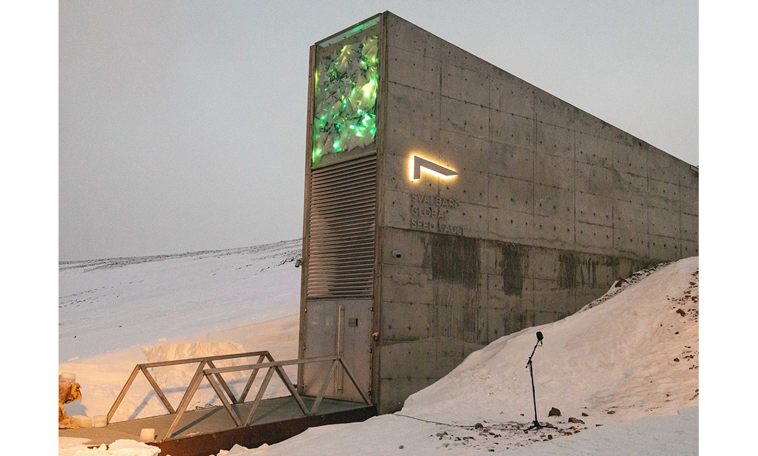 The Svalbard Global Seed Vault, a large grey, rectangular building standing in snow