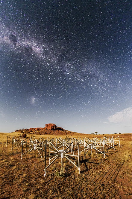 One of 256 tiles of the Murchison Widefield Array (MWA) radio telescope - small, white x-shaped panels set against the WA outback