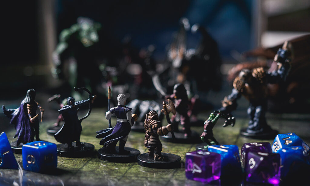 Closeup of a Dungeons and Dragons game board showing dice and figurines
