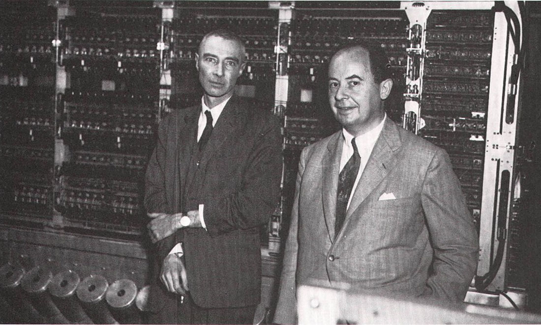 Black and white photo of scientists Oppenheimer and von Neumann in Los Alamos National Lab.