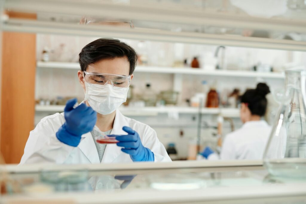 A man cultures cells in a lab